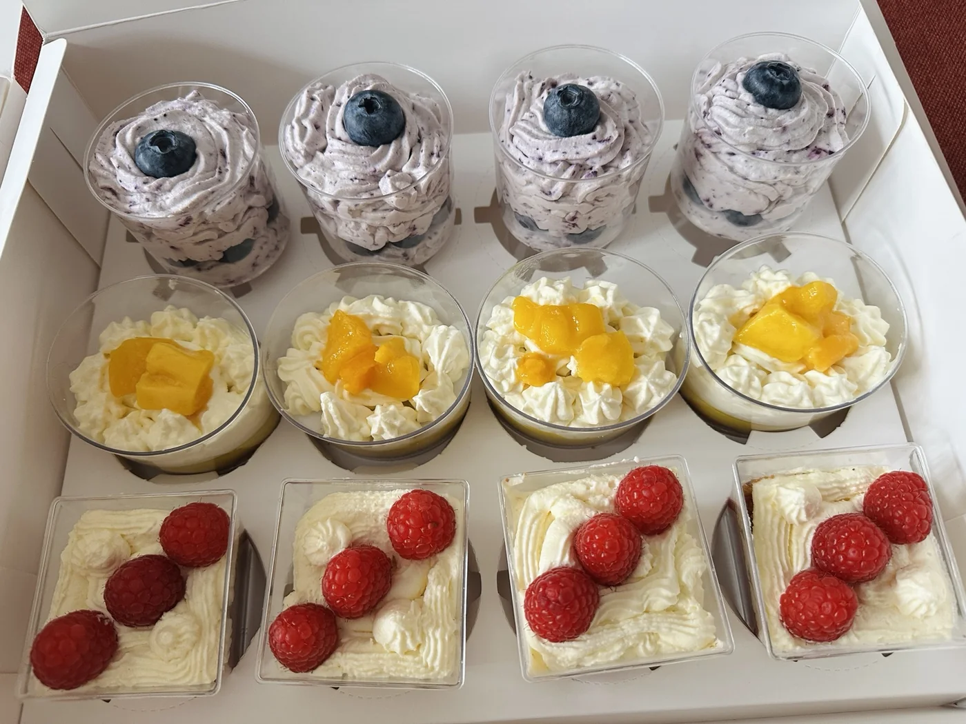 An assortment of individual mini dessert cups