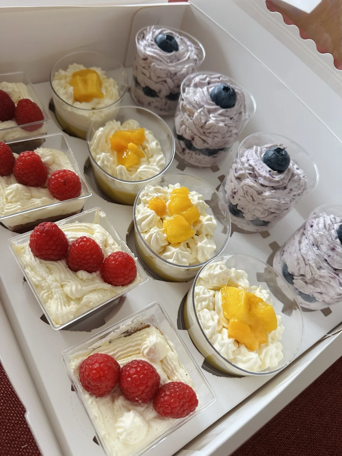 Individual layered dessert cups arranged for sharing